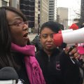 Planned Parenthood President Iris Harvey at a protest with a bullhorn