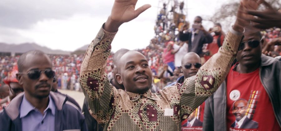 President Nelson Chamisa at rally, holding his hands up