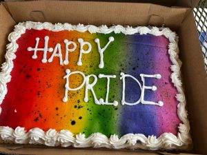 A cake with "Happy Pride" written in icing. 