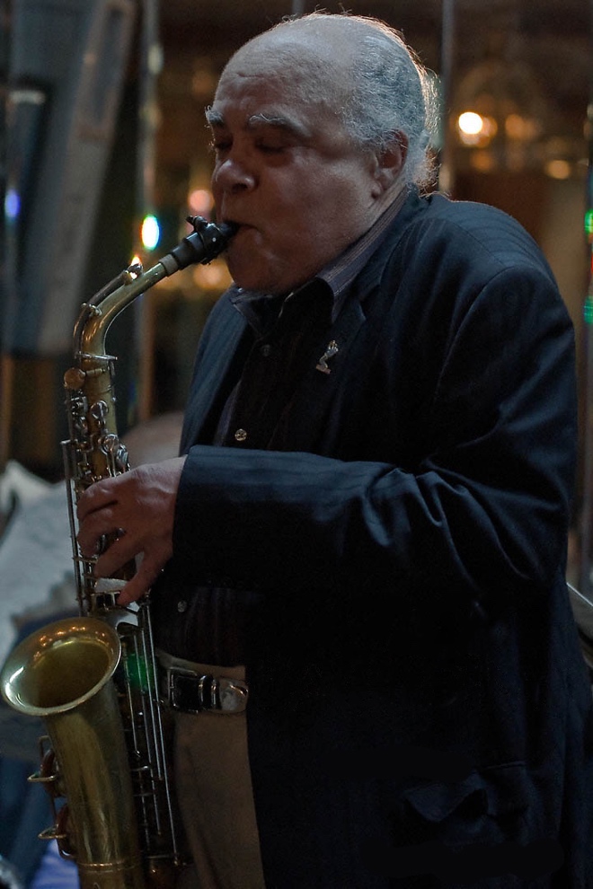 A photograph of jazz musician James Spaulding. He is playing a saxophone. 