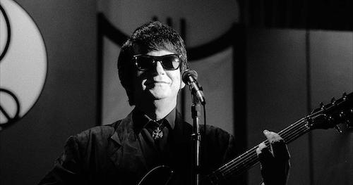 older Roy Orbison in from of microphone