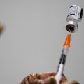 A syringe is prepared with the Pfizer COVID-19 vaccine at a vaccination clinic at the Keystone First Wellness Center in Chester, Pa.