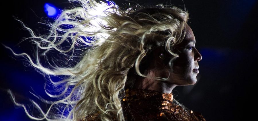 Beyoncé performs at San Siro Stadium in Milan, Italy on July 18, 2016 as part of The Formation World Tour. The image is of the artist's profile, her hair blowing behind her.