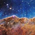 What looks much like craggy mountains on a moonlit evening is actually the edge of a nearby, young, star-forming region NGC 3324 in the Carina Nebula.