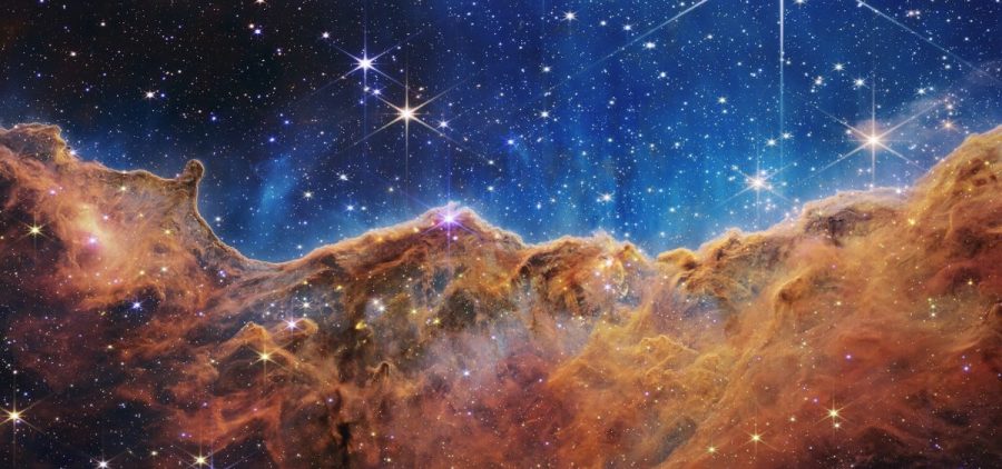 What looks much like craggy mountains on a moonlit evening is actually the edge of a nearby, young, star-forming region NGC 3324 in the Carina Nebula.