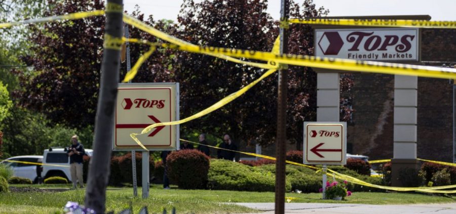 Police tape surrounds Tops Friendly Market the day after the fatal shooting of 10 people on May 14 in Buffalo, N.Y.