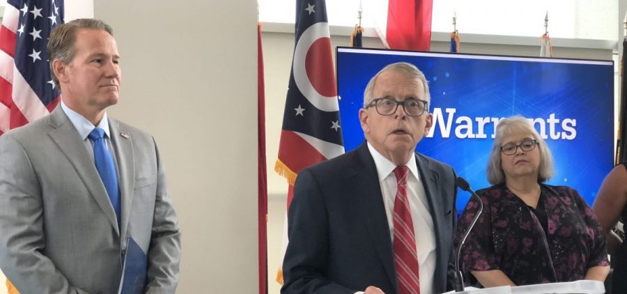Gov. Mike DeWine (R-Ohio) and Lt. Gov. Jon Husted (R-Ohio) roll out new eWarrants system for information entry into databases used for background checks at a press conference.