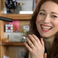 Regina Spektor clasping her hands and smiling during her Tiny Desk set.