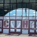 The front of Vinton County High School with V C H S on the windows