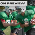 Fairland football players in practice uniforms and pads running drill