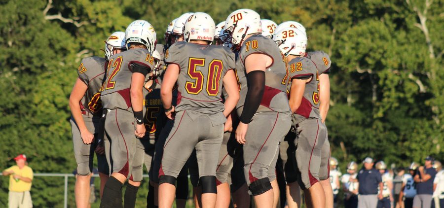 Berne Union's offense huddles up before a play