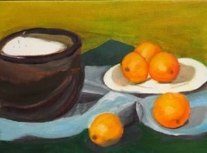 A painting of a brown bowl with a white substance in it next to a plate of oranges, all laid out on a blue cloth against a yellow wall.