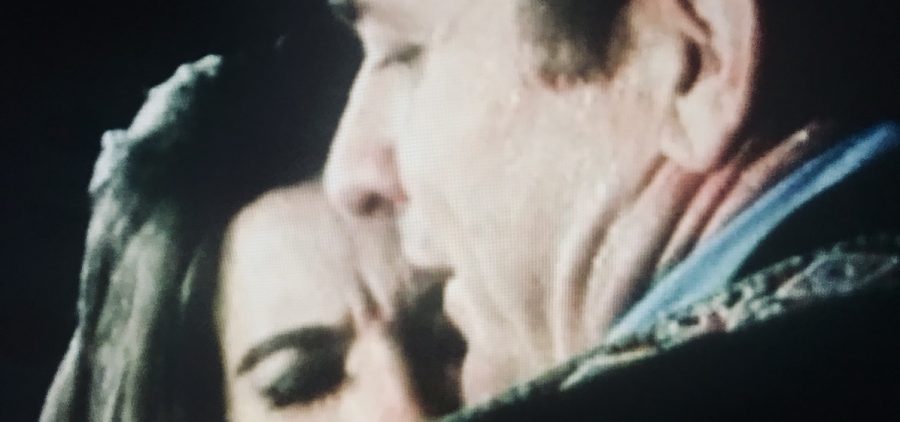 close up of Johnny Cash hugging Rosanne
