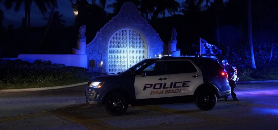 Police stand outside an entrance to former President Donald Trump's Mar-a-Lago estate on Aug. 8, 2022, in Palm Beach, Fla.