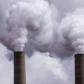 A power plant's smoke stack emit emissions