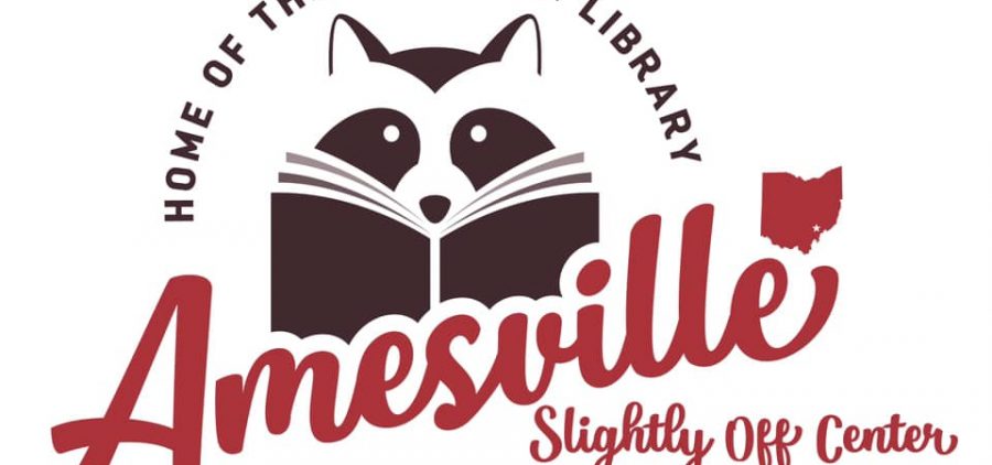 The logo for the Amesville Library. A raccoon reading a book with text that reads "Home of the coonskin library: Amesville - Slightly Off Center