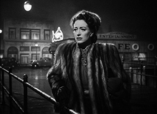 A black and white promotional still from the film "Mildred Pierce."