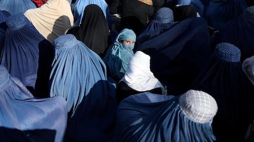 group of Afghan women completly covered except for one set of eyes
