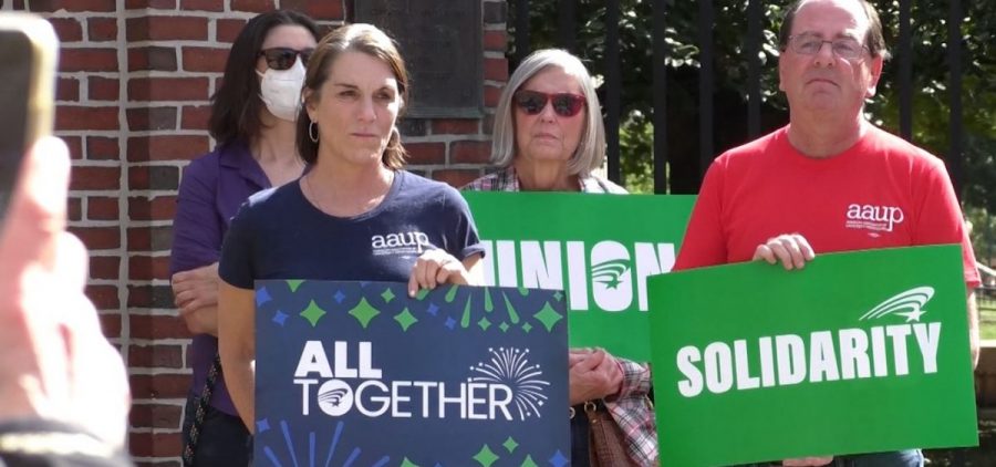 AFSCME members rally on the campus of Ohio University and hold signs