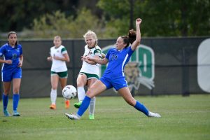 Ohio Soccer's Abby Townsend goes for the ball against a Buffalo player