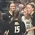 The Ohio volleyball team gathers at center court and celebrates after winning a point against Bradley