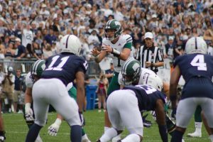 Ohio Quarterback Kurtis Rourke (7) taking a snap against the Penn State defense in Happy Valley 