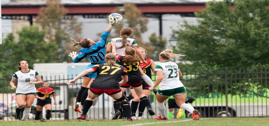 Isabella Ginocchi (6) battles for the header against the VMI keeper in Athens, Ohio, on Sunday, Sept. 4, 2022. [Alex Eicher | WOUB]