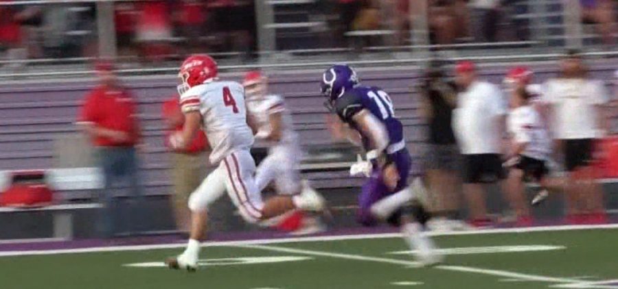 Union Local player runs from a Martins Ferry defender for an eventual touchdown