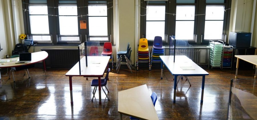 Desks are spaced apart ahead of planned in-person learning at an elementary school on March 19, 2021, in Philadelphia.
