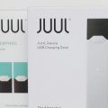 Two Juul packages in front of a white background