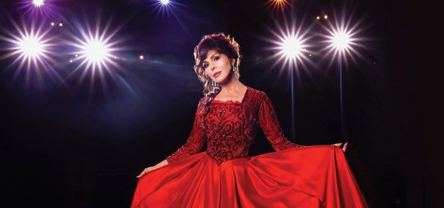 A promotional picture of Marie Osmond. The performer is wearing a red gown.