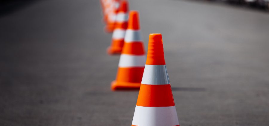 Traffic cones line a road