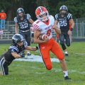 A Nelsonville-York player runs away from a River Valley defender