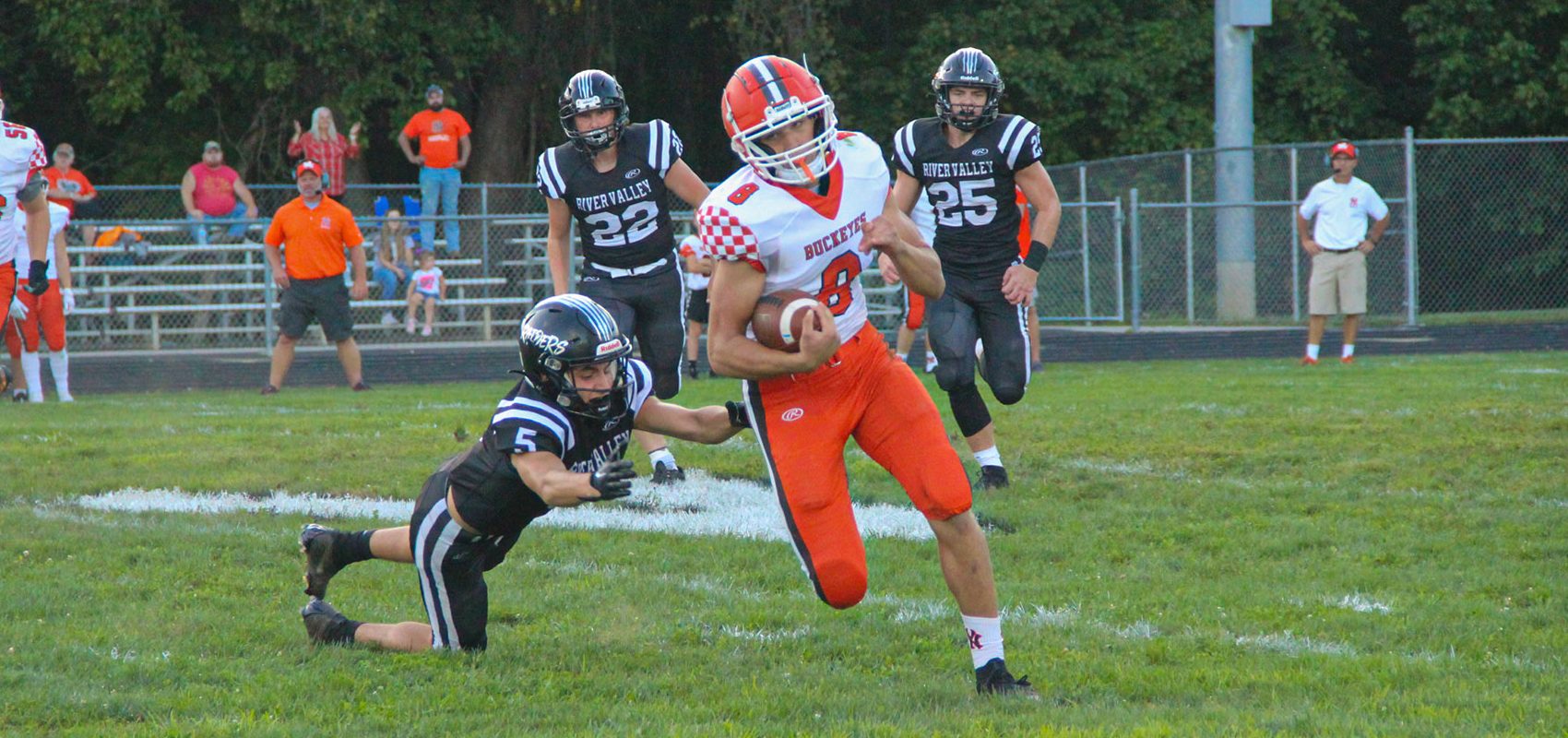 A Nelsonville-York player runs away from a River Valley defender