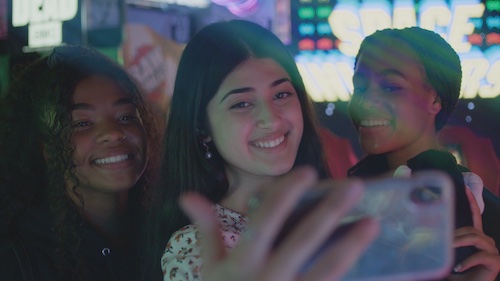 TikTok Influencer Feroza Aziz taking selfie with her friends in the arcade