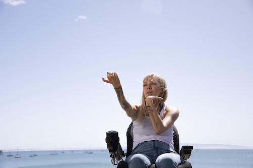 woman in wheelchair at beach