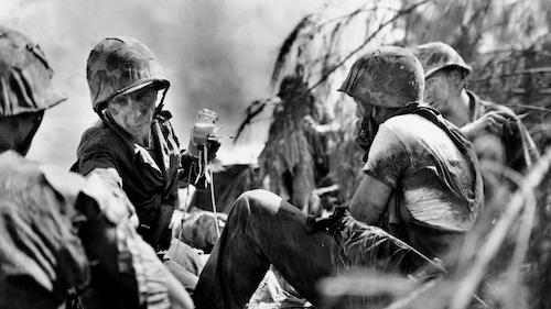 WWII soldiers with medic in the field