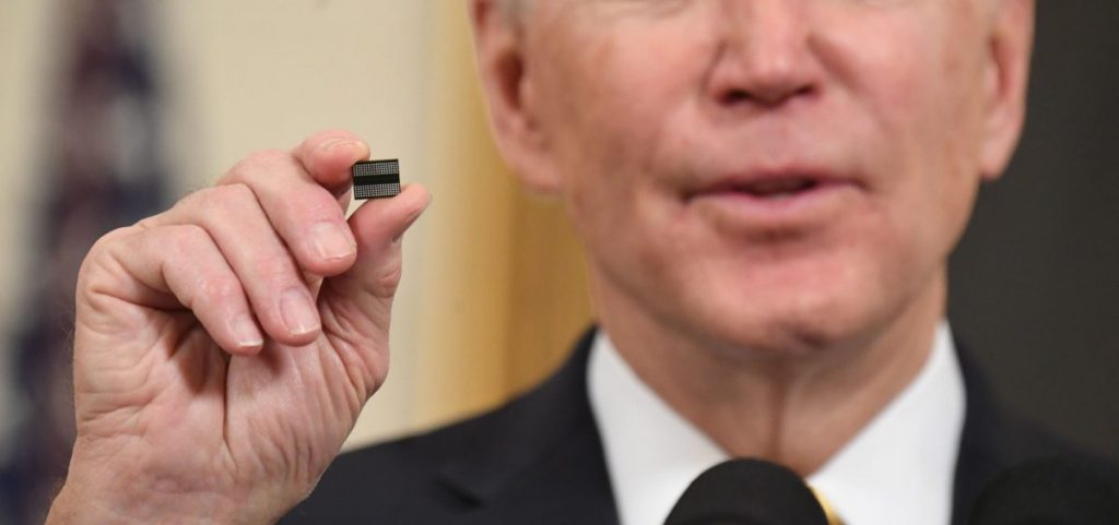President Biden holds a semiconductor chip in this 2021 file photo.