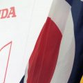 Ohio flag and Honda sign at event where Honda announced new battery plant in Fayette County.