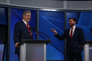 Tim Ryan and J.D. Vance smile on state of Monday's U.S. Senate Debate in Cleveland.