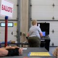Poll workers and voters are seen during Wisconsin's state primary on Aug. 9.