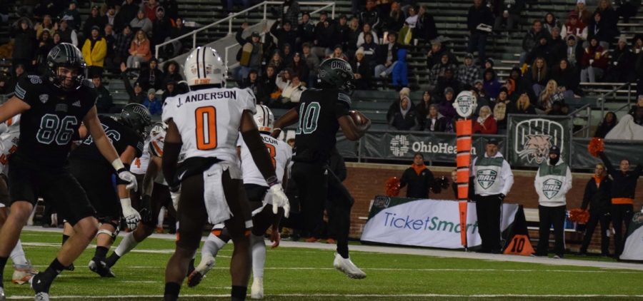 Ohio quarterback CJ Harris (10) leaps into the end zone against the Bowling Green Falcons