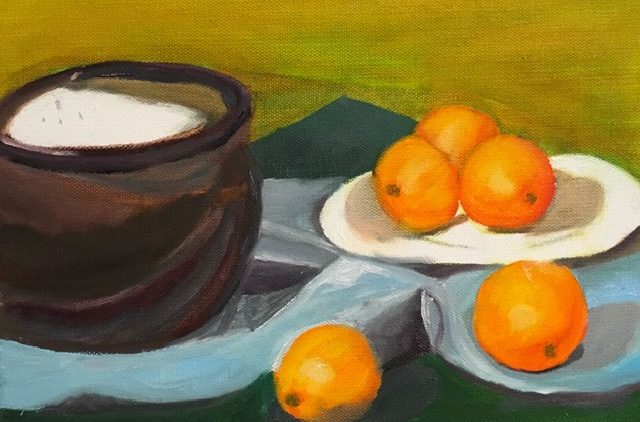 An image of oranges which are painted.
