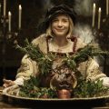 Lucy Worsley in Henry VIII costume with boar's head.
