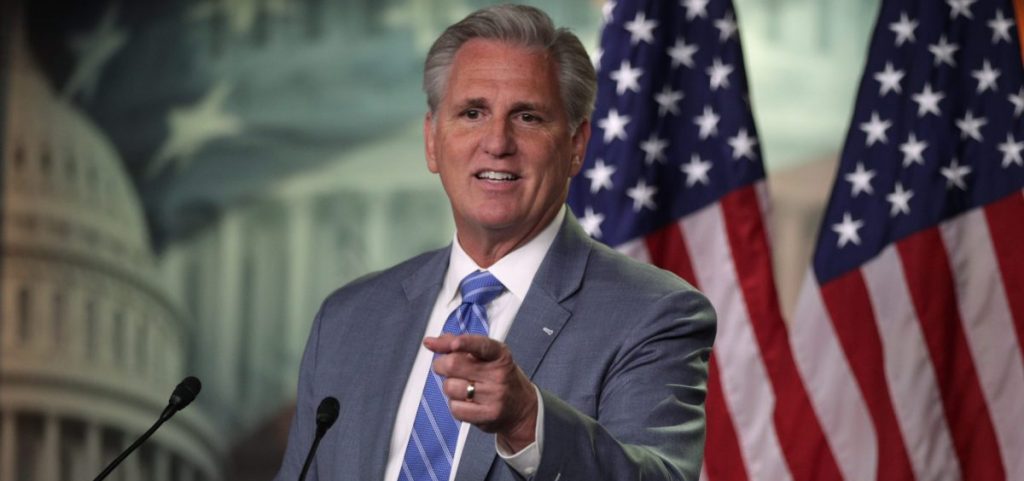Rep. Kevin McCarthy of California points to the crowd from behind a podium at a press conference