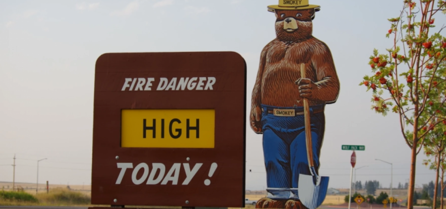 A Forest Service sign states that the fire danger is high