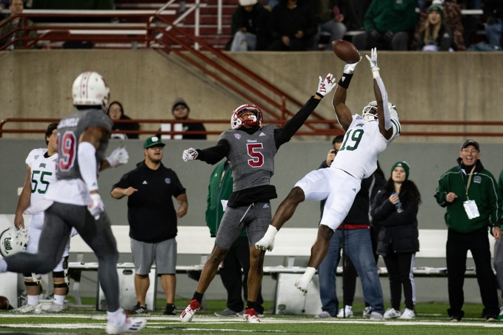 Miles Cross catches a pass while being covered by Miami defensive back John Saunders Jr [Alex Eicher | WOUB]