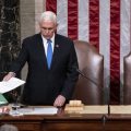 Vice President Mike Pence, left, and Speaker of the House Nancy Pelosi, D-Calif., return to the House chamber after midnight, Jan. 7, 2021, to finish the work of the Electoral College