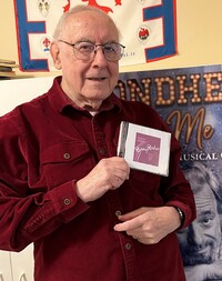 Journalist Paul Salsini holds the CD containing a rare live recording of "Phinney's Rainbow." He found the CD while cleaning up his office.