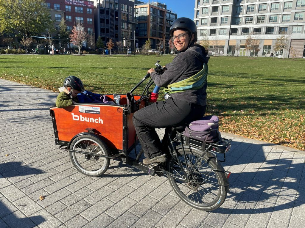 Lelac Almagor carries her son, 3-year-old Oren, and infant daughter, Tamar, in her e-cargo bike.